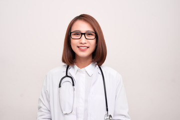 Portrait of an attractive young female asian doctor in white coat