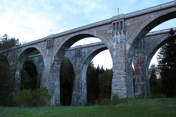 Fototapeta na wymiar Old concrete railway bridges in Stanczyki, Mazury, Poland