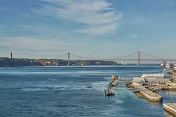 Fototapeta premium The 25 April bridge (Ponte 25 de Abril) is a steel suspension bridge located in Lisbon, Portugal, crossing the Tagus river. It is one of the most famous landmarks of the region