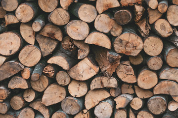 A bunch of logs. Firewood texture. Brown wooden lumber background. Old wall wood vintage texture. Grunge wooden rustic textured, white wood, surface