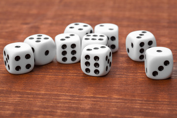 Dice on wooden table. Background for casino games.