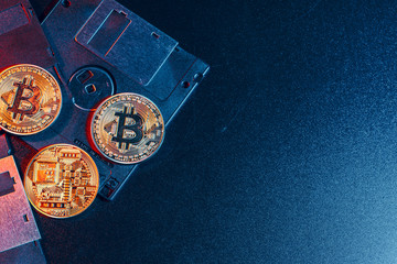 golden bitcoin on floppy disk