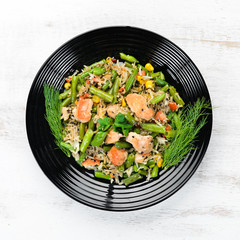 Risotto with chicken fillet and vegetables. Rice. Top view. Free copy space.
