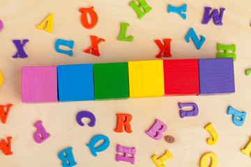 Colorful wooden blocks background, top view