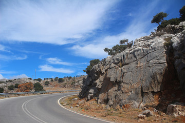 Asphalt road on the background of a mountainous landscape.sky in the clouds. Beautiful panorama.
