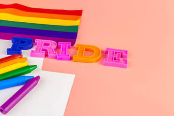 text pride, with lgbt rainbow flag