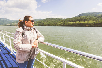 Fototapeta premium Happy tourist woman enjoy view of Danube river at cruise ship
