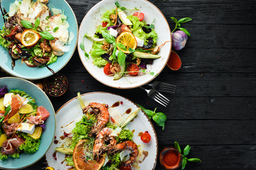 A set of salads. In the plate. Rustic style. Top view. Free space for your text.