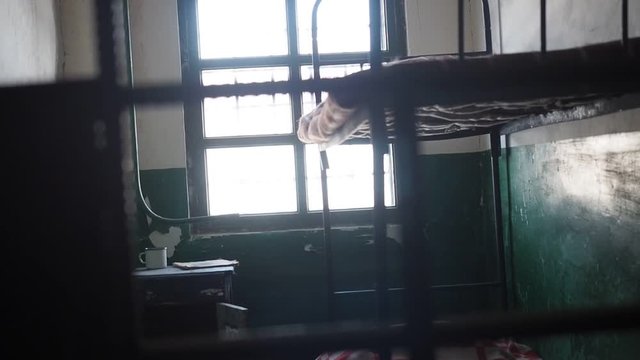 Prison interior. Illegal immigration prison fence concept.  Old grunge prison cell. 
