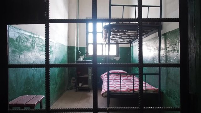 Prison interior. Illegal immigration prison fence concept.  Old grunge prison cell. 