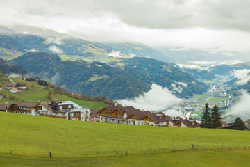 Picturesque autumnal view on green meadow of Maranza / Meransen, alpine plateau in South Tyrol....