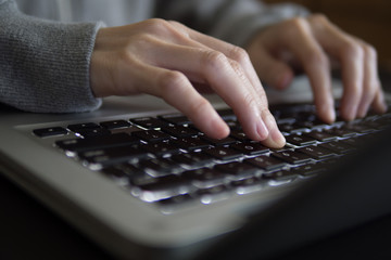 Freelancer use laptop at home, close up.