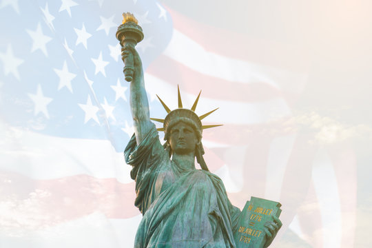 Image of double exposure statue of liberty and USA flag. Background for Independence day or Memorial day.