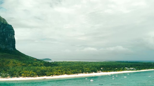 Panoramic aerial view of Le Morne beach in Mauritius, slow motion