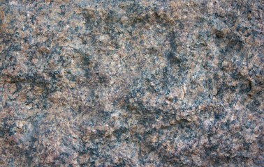 Red granite texture in daylight