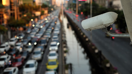CCTV camera with traffic jam blur background