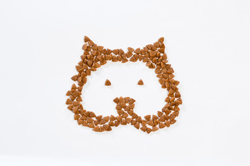 Obraz premium figure of cat head lined with food on a white background