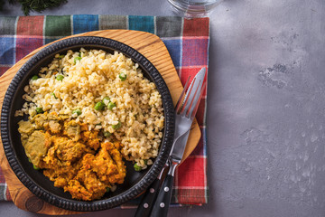 Carrot balls garnish with bulgur and green peas. Top view. Copy space