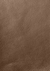 The texture of genuine leather. Impeccable and stylish background. Beautiful stylish background. Natural skin texture close up. Brown background.  The structure of the leather material brown shades.
