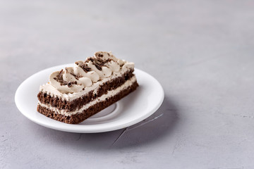 Small Coffee Chocolate Cake on White Plate Grey Background Tasty Beautiful Dessert Chocolate Cake Pastry Copy Space