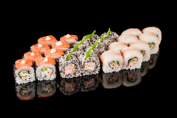 Sushi Roll - Maki Sushi pieces collection with Salmon Roe, Smoked Eel, Cucumber, Cream Cheese, Sesame, Avocado, Onion Fries, Crab Meat, Tobiko isolated on black background - Image