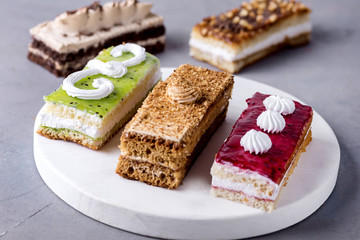 Assorted Different Mini Cakes with Cream Coffee Chocolate Salted Caramel and Berries Above Horizontal Tasty Mini Cakes Dessert Pastry