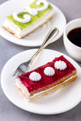 Tasty Fruit and Berry Mini Cakes on white Plates Cup of Coffee Above Vertical Tasty Dessert Tasty Cake