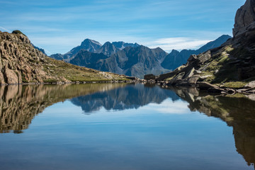 Reflection of pyrenees mountains in lake