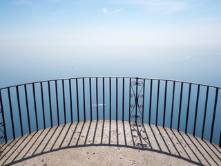 Italy, april 2019: Ravello, Villa Cimbrone in a sunny summer day, infinite terrace and white statues over the Amalfi Coast coastline.