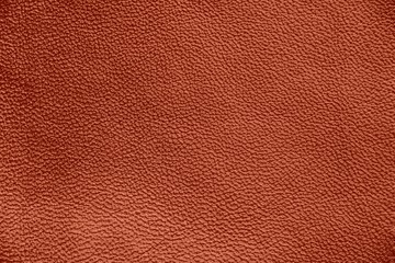 The texture of genuine leather. Impeccable and stylish background. Beautiful stylish background. Natural skin texture close up. Brown background.  The structure of the leather material brown shades.