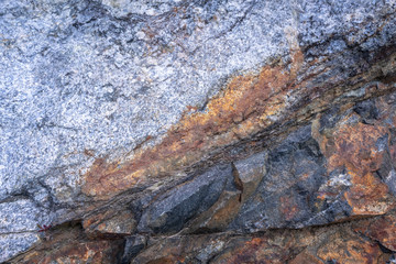Rusty texture. Stone rusty background. Colorful granite stone background. Old Cracked Rusty Rough texture. Rock wall backdrop with rough red brown texture. Grunge Abstract Stone Surface. 