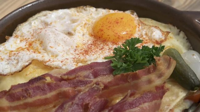 Fried eggs and bacon serving on plate