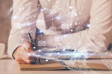 Polygonal hands using tablet with abstract e-mail network. Communication concept. Double exposure.