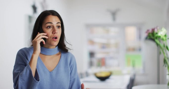 4K Frustrated Spanish speaking woman having a heated conversation on the phone. Slow motion.