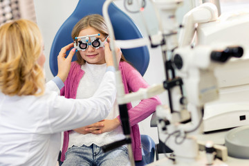 Girl at eye specialist controls vision
