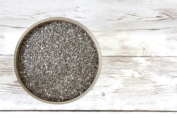 Healthy Chia seeds on the wooden table and copy space. Top view.