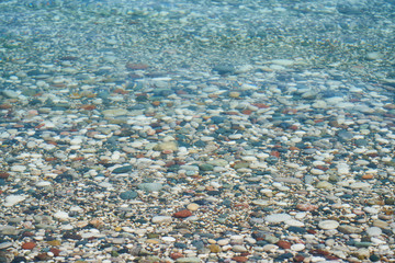 Blue sea and pebbles background