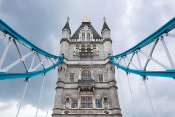 Fototapeta na wymiar Tower Bridge close up over dramatic cloudy sky .