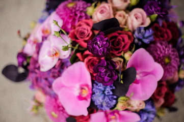 Close up box of tender pink, violet and blue flowers
