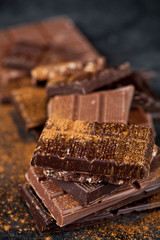 Chocolate bar pieces heap witn cinnamon powder.