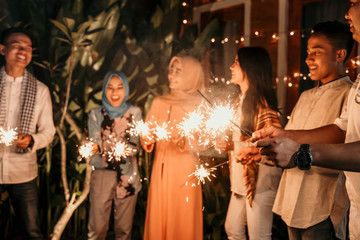 Playing firework to celebrate Eid Mubarak with friends at hometown