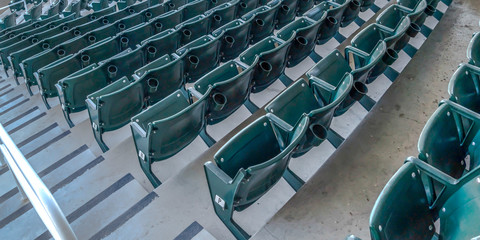 Fototapeta premium Panorama Tiered seating and viewing rooms on a baseball field viewed on a sunny day
