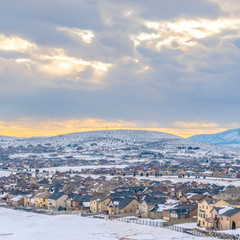 Clear Square Beautiful homes near the base of a frosty mountain viewed during winter season