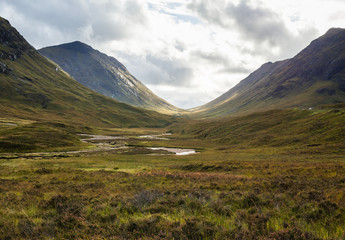 The Pass of Glen Coe in the Scottisch Highlands under a dramatic sky