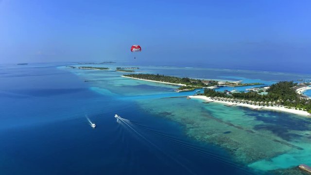 Aerial Shot of South Mal&eacute; Atoll with paraglider