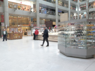 Fototapeta premium Blurred image of supermarket clothing store. background. hypermarket. shop with windows. buying clothes and shoes