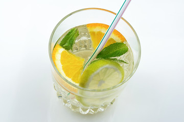 Glass of drink with citrus juice