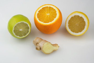 Citrus fruits with a piece of ginger root