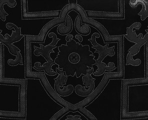 Fond velours noir &agrave; motifs g&eacute;om&eacute;triques gris.