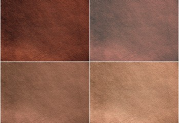 Fototapeta premium The texture of genuine leather. Impeccable and stylish background. Beautiful stylish background. Natural skin texture close up. Brown background. The structure of the leather material brown shades.